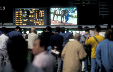 people bet of a Horserace in the statium at a horse Race at Sha Tin near the city of Hongkong in...
