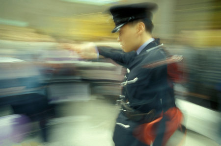 the Hong Kong Police at work in Tsim Sha Tsui in Kowloon in the city of Hongkong in Hongkong. ...