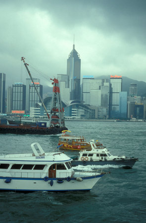 ship traffic with a view on the Victoria harbour in front of the Skyline of Central Hongkong from...