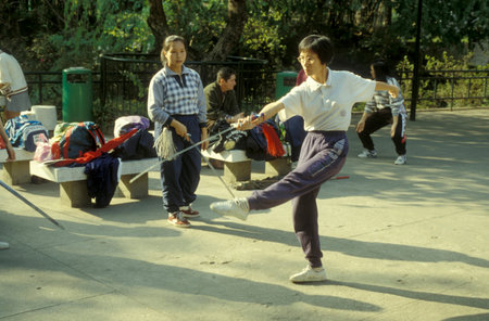 people exercise and Tai chi in a park of Central Hongkong in the city of Hongkong in Hongkong. ...