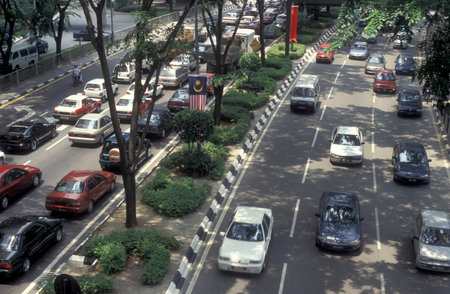 cars and Trafic on a road in the city of Kuala Lumpur in Malaysia.  Malaysia, Kuala Lumpur, January,...