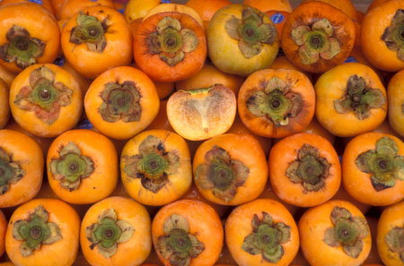 Tropical Kaki fruits at a market in the city of Kuala Lumpur in Malaysia.  Malaysia, Kuala Lumpur, January, 2003のeditorial素材