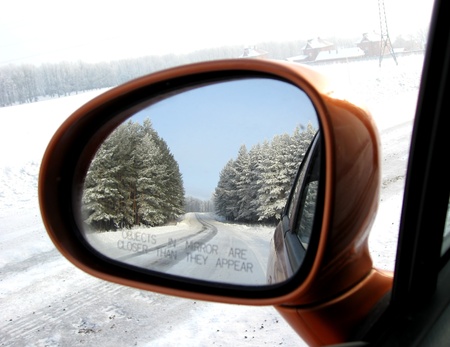 Reflection of road in mirror at sunny dayの写真素材