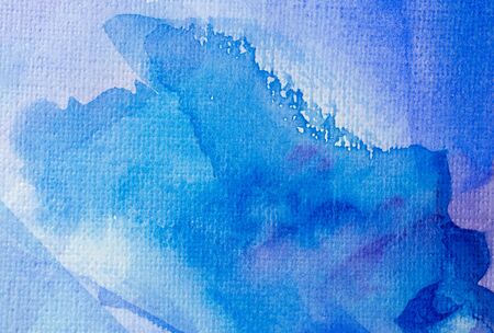 Abstract blue watercolor background with different layers on paper textureの写真素材