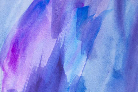 Abstract Hand painted blue purple watercolor background on wet paper, texture for creative wallpaper or design artwork.の写真素材