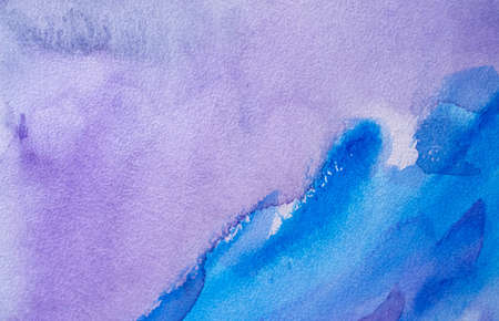 Abstract Hand painted blue purple watercolor background on wet paper, texture for creative wallpaper or design artwork.の写真素材