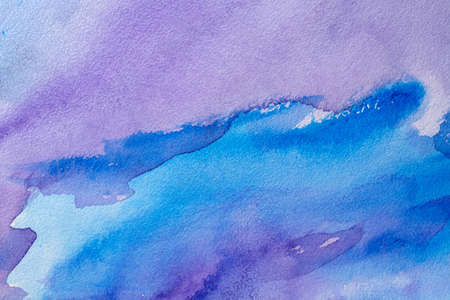Abstract Hand painted blue purple watercolor background on wet paper, texture for creative wallpaper or design artwork.の写真素材