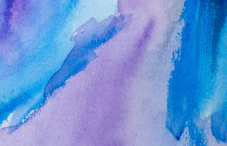 Abstract Hand painted blue purple watercolor background on wet paper, texture for creative wallpaper or design artwork.の写真素材
