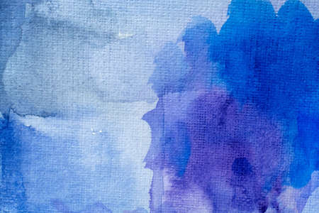 Abstract Hand painted blue purple watercolor background on wet paper, texture for creative wallpaper or design artwork.の写真素材