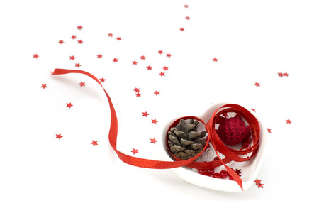 Picture with red ribbon, heart shape small bowl and decorationsの写真素材