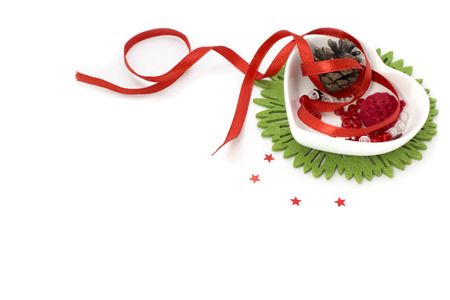 Picture with red ribbon, heart shape small bowl and decorationsの写真素材