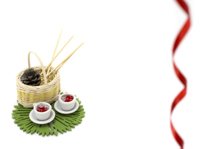 Picture with two miniature cup, mini basket and decorationsの写真素材