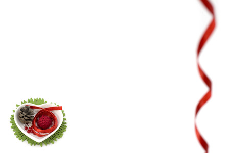 Picture with red ribbon, heart shape small bowl and decorationsの写真素材