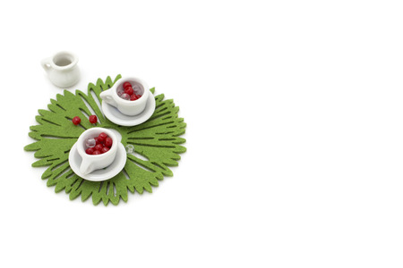 Picture with two miniature cup and decorationsの写真素材
