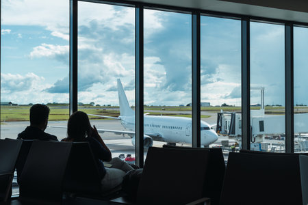 silhouettes of a couple at the airportの写真素材