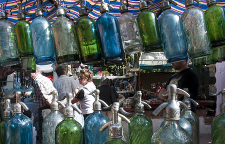 People walking through the San Telmo in market seen through Soda Syphons for sale in 10th October 2009.のeditorial素材