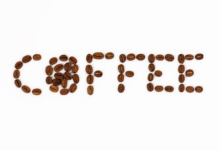 Fresh Coffee Beans spelling out Coffee isolated on a White Background.の写真素材