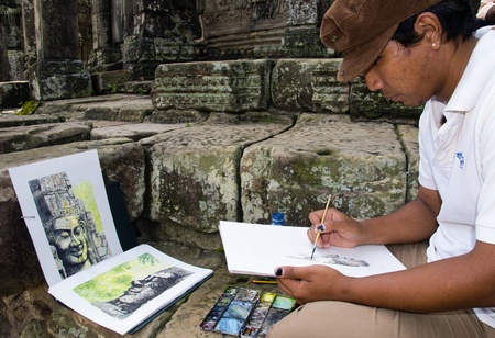 Unidentified Cambodian artist inside the grounds of Angkor Wat, Cambodia, June 5th 2010. More then 40% of the Cambodian population still live in poverty.のeditorial素材