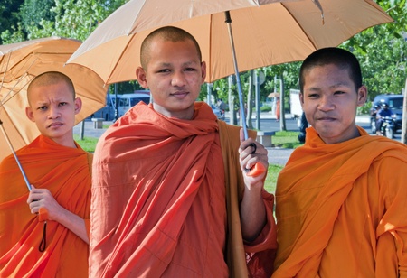 Three young Cambodian Monks in Phnom Pehn, Cambodia, June 12 2010. Buddhism is the dominant religion in Cambodia after Islam and Christianity.のeditorial素材