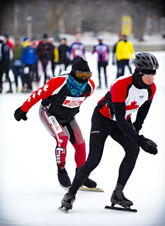 Blind triathlete Kevin Frost (left) who is led by Jake Maarse starts the 30th Annual Winterlude Triathlon at Dow's Lake, Ottawa on Saturday 2nd February 2013.のeditorial素材