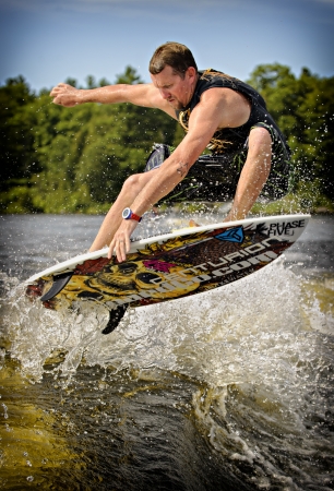 Drew Danielo competes in the 1st annual Calabogie Wake Surf Championship held on Calabogie Lake, Ontario, Canada on July 12 2013. Drew finished 2nd in both the Pro Mens Skim and Surf competitions.のeditorial素材