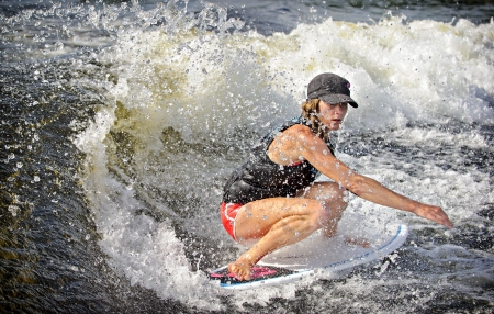Canadian Caroline Villeneuve competes in the 1st annual Calabogie Wake Surf Championship held on Calabogie Lake, Ontario, Canada on July 12 2013. Caroline finished 1st in the Pro Women's Skim competitions.のeditorial素材