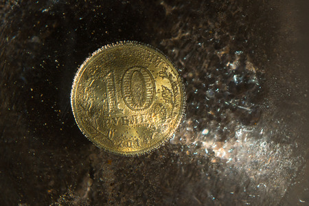 Ruble coin submerged and covered with air bubbles.の写真素材