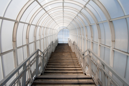 Passage in glass corridor inside a modern buildingの写真素材