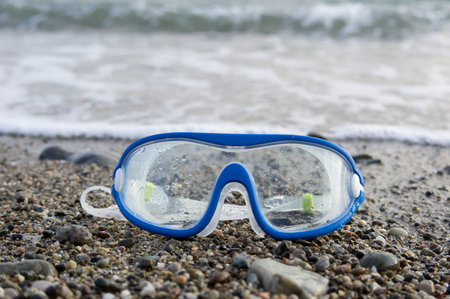 Blue swimming glasses with elastic band