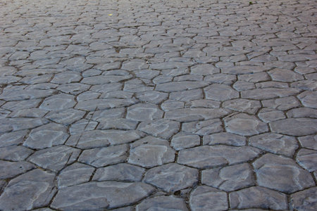 Sidewalks are laid out with tiles of a chaotic shape.