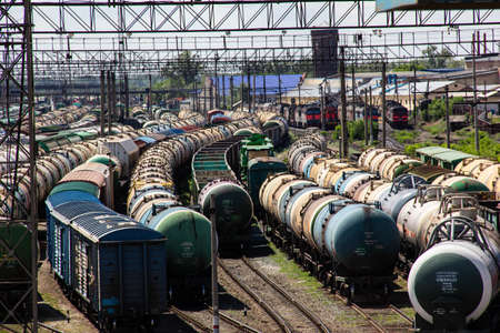 Freight rail cars and tank cars on the tracks waiting for the locomotive.の写真素材