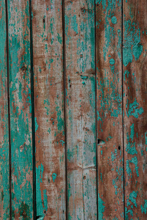 The texture of the background is made of battered wooden boards with peeling paint.の写真素材