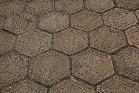 The texture of a sidewalk lined with hexagonal paving slabs.の写真素材