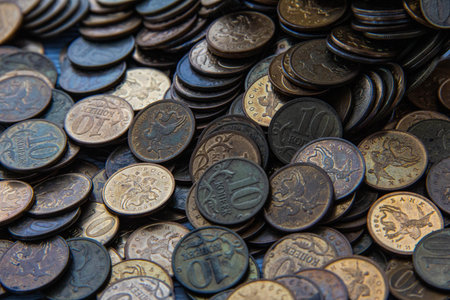 Ten-kopeck coins are scattered on the table. Scattered coins.の写真素材