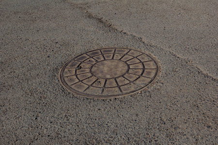 Old cast iron manhole coverの写真素材