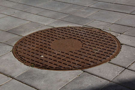 Old cast iron manhole coverの写真素材
