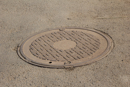 Old cast iron manhole coverの写真素材