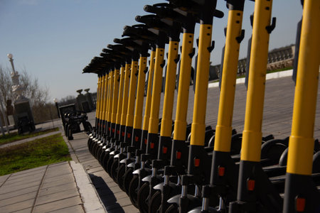 Electric scooters parked on a city street.