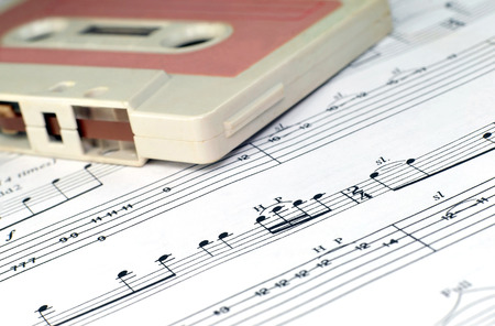 Close up photo of old cassette and music notesの写真素材