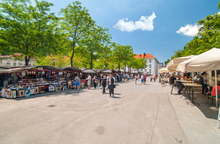 Ljubljana, Slovenia - June 7, 2016 People walking and shopping in Ljubljana's central market on a bright sunny dayのeditorial素材