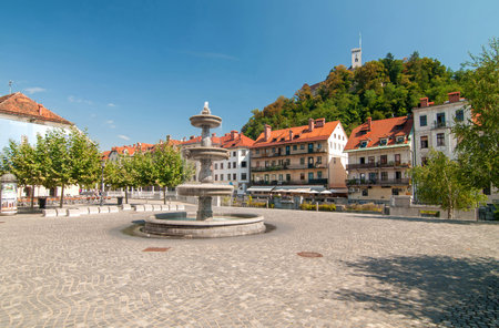 Fountain in New square and castle in the background, Ljubljana, Sloveniaの写真素材