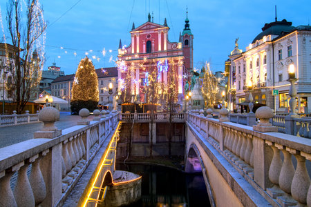 Triple bridges, Christmas tree on Preseren's square and Franciscan church, illuminated for Christmas and New Year's celebration, Ljubljana, Sloveniaのeditorial素材