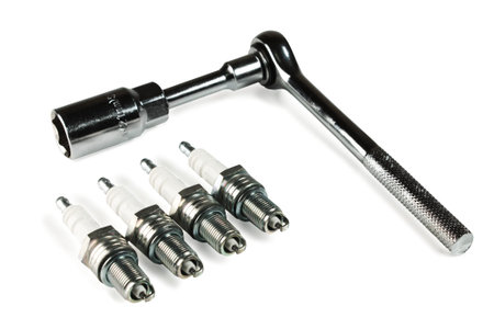 four sparks and spanner on white background