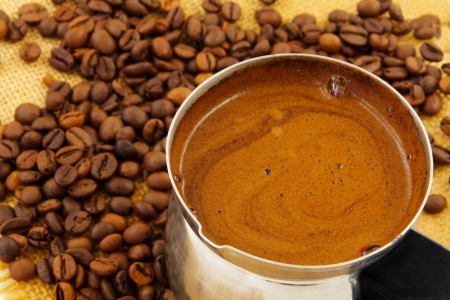 coffee maker wiht coffee and coffee beans on burlapの写真素材