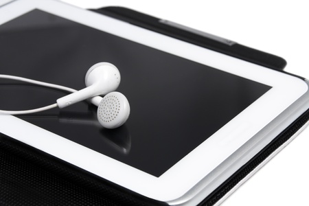 Headphones on digital tablet   close up  White Backgroundの写真素材