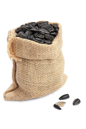 sunflower seed in sack on  white backgroundの写真素材