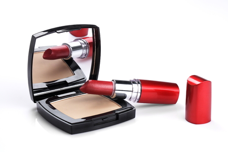 lipstick and Powder Compact on white backgroundの写真素材