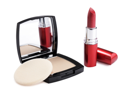 powder compact and red lipstick  on white backgroundの写真素材