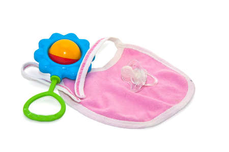 toy, bib and pacifie white backgroundの写真素材