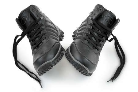 winter leather shoes on white backgroundの写真素材